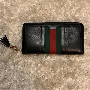 Gucci pebbled leather web bamboo zippy wallet
